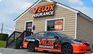 Velox Insurance branded car.